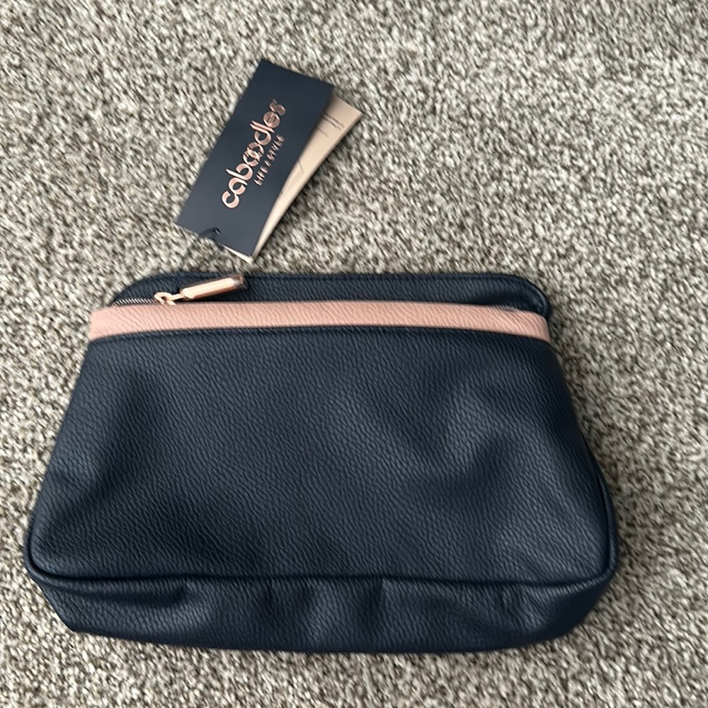 Organized bag in navy and pinkish.